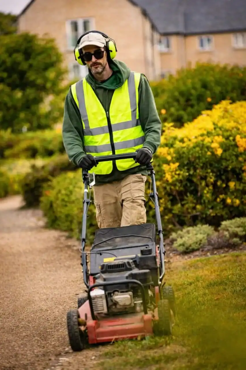 Man Mowing a Lawn